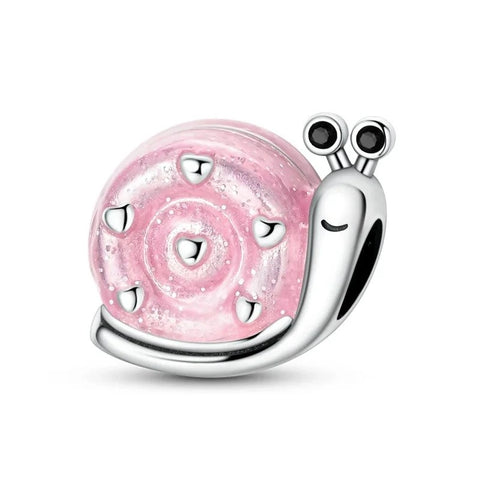 A silver tone snail charm with a sparkling pink glitter enamel shell featuring heart accents and a spiral pattern, black crystal eyes on antennae, and a winking facial expression