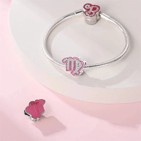 Silver bracelet with pink Virgo charms.