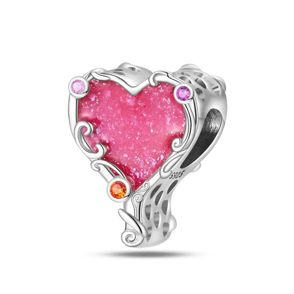 Sterling Silver Pink Heart Stone Charm - A sterling silver charm with a bold pink heart stone, surrounded by intricate silver swirls and colorful zirconia accents.