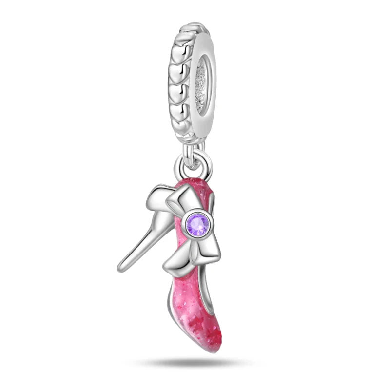 A sterling silver high heel charm with pink enamel and a zirconia-studded bow, designed for fashion lovers.