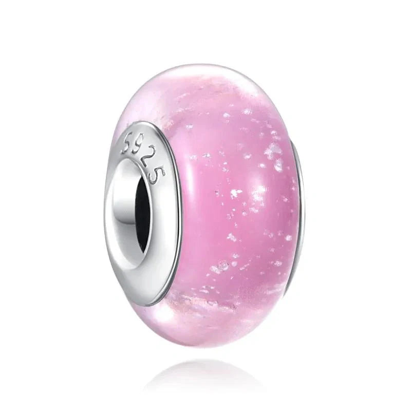 Sterling silver charm with pink shimmering glass for a soft, romantic look.