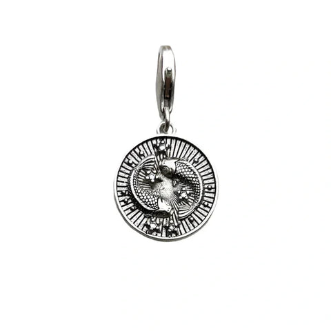 Silver pendant with intertwined snakes.