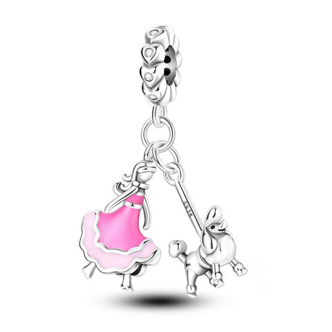 Silver Poodle Girl Charm - Silver girl with poodle charm with pink dress accents.