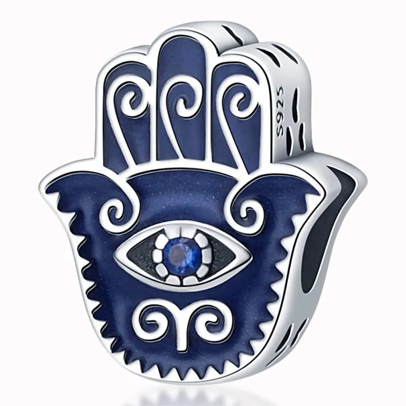 protective hamsa hand charm in sterling silver with eye and enamel details