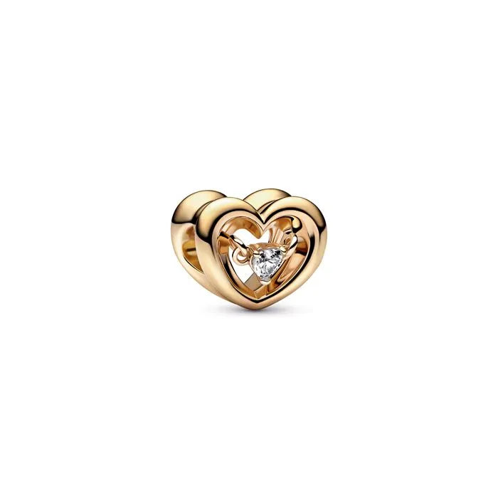 Radiant Heart Floating Stone Charm Pandora Shine - Heart charm with floating stone in Pandora Shine, adding luxury.