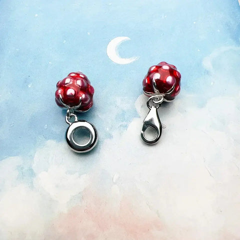 Red raspberry charm pendants.