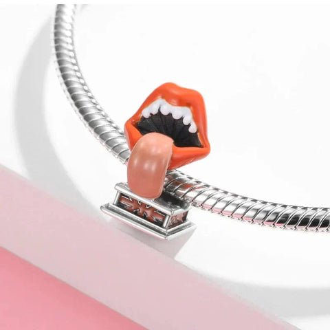Lips and tongue charm on a silver bracelet.