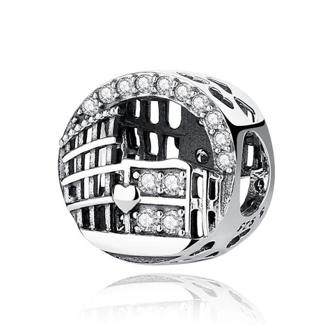 Roman Colosseum Arch Silver Charm with Crystal Accents - A sterling silver Roman Colosseum arch charm with openwork architectural details, a small heart motif, and clear cubic zirconia crystal accents along the arch and center panel.