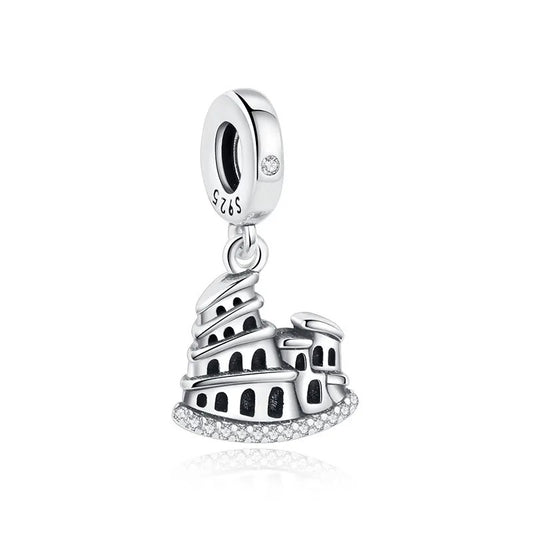 A sterling silver dangle charm shaped like the Roman Colosseum, with detailed archways and a row of clear cubic zirconia stones along the base, hanging from a round clip-on bale stamped S925.