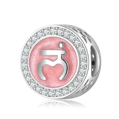 Silver charm with pink symbol and rhinestone border.