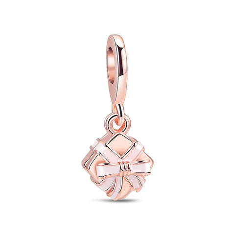 Rose gold gift box charm with bow, ideal for Pandora bracelet charms.