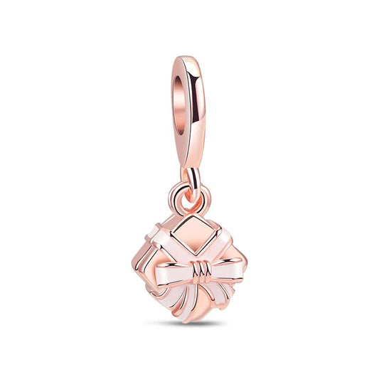 Rose gold gift box charm with bow, ideal for Pandora bracelet charms.