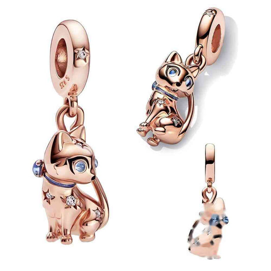 Rose gold cat charm with cubic zirconia accents and blue eyes