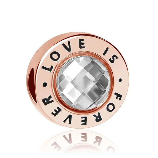 Rose gold-plated sterling silver charm with a clear faceted crystal and engraved "Love is Forever" message.