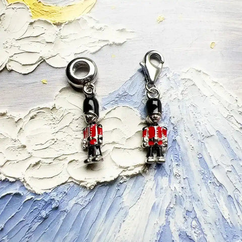 Two British guard charms.