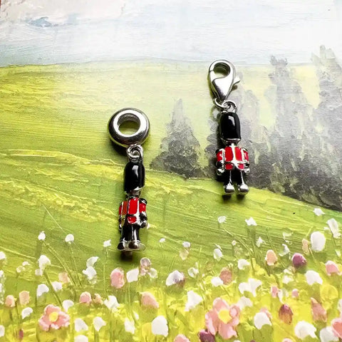 Two British guard charms.