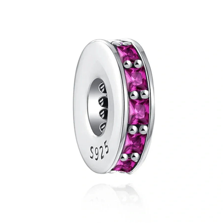 Sterling silver spacer charm with ruby red cubic zirconia stones for a bold and vibrant look.