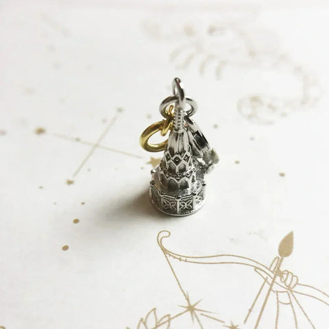 Silver and gold temple charm.