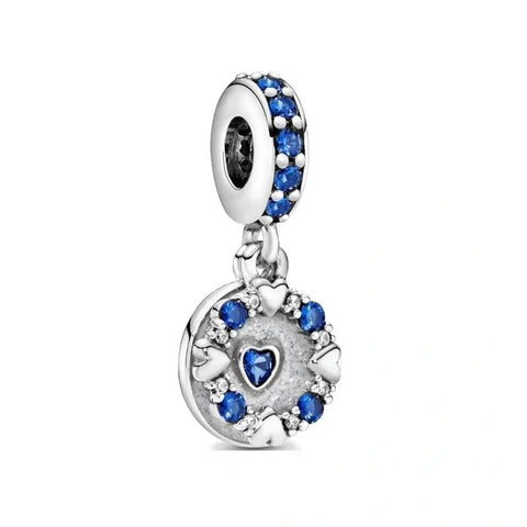 Shimmering Star Charm with Blue Crystals in Sterling Silver - Star-shaped sterling silver charm with blue crystals, adding sparkle and magic to any jewelry collection.
