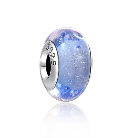 Shimmering Blue Glass Charm in Sterling Silver - Sterling silver charm with shimmering blue glass for a soft and radiant look.