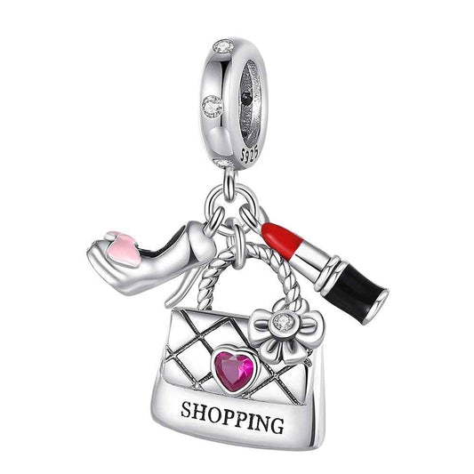 Fashionable shopping bag charm with high heel, lipstick, and quilted bag, sterling silver.