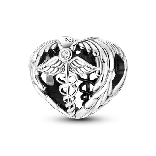 Sterling silver heart charm featuband a caduceus symbol with wings and a cubic zirconia.