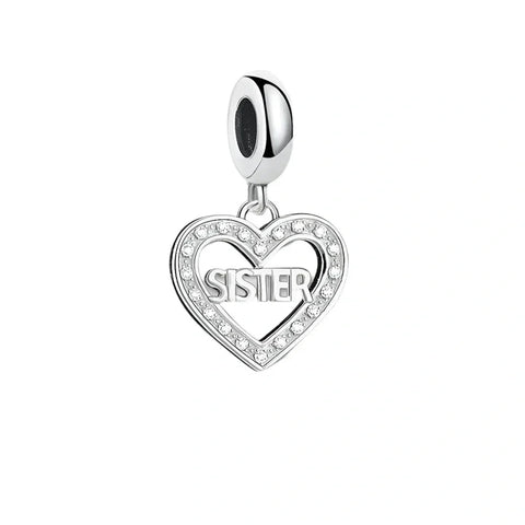 Silver heart charm with 'Sister' inscription.