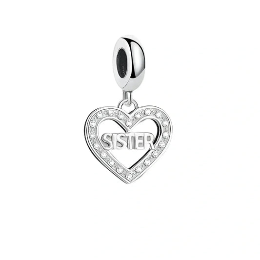 Silver heart charm with 'Sister' inscription.