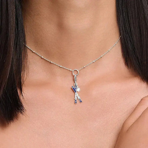 Silver necklace with ski charm.