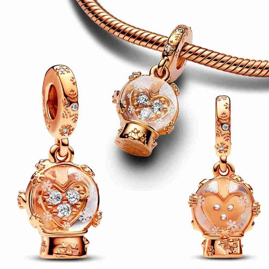 Rose Gold Snow Globe Charm with sparkling details and snowflake engravings, perfect for capturing the magic of the winter season.