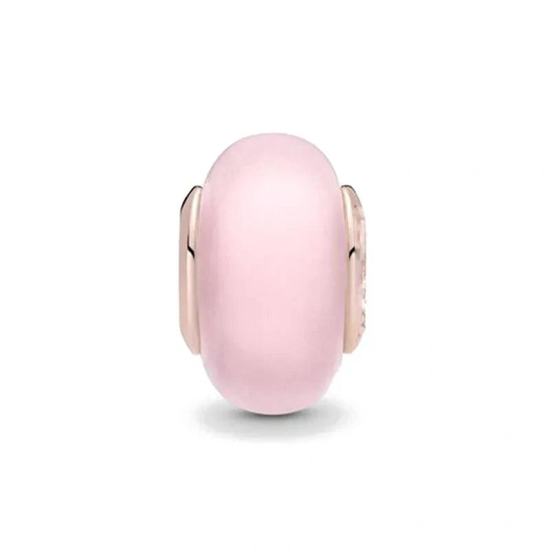 Soft pink enamel charm with rose gold-plated sterling silver accents for a feminine and elegant look.