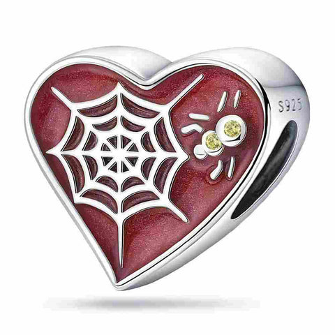 Heart-Shaped Spider Web Charm with Sterling Silver and Enamel - Heart-shaped sterling silver charm with a spider web design, red enamel, and yellow crystal accents.