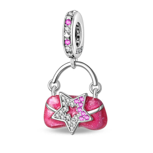 Star bag charm in pink glitter enamel, perfect for charm bracelet collections.