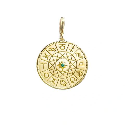 Gold zodiac pendant with a green gemstone.