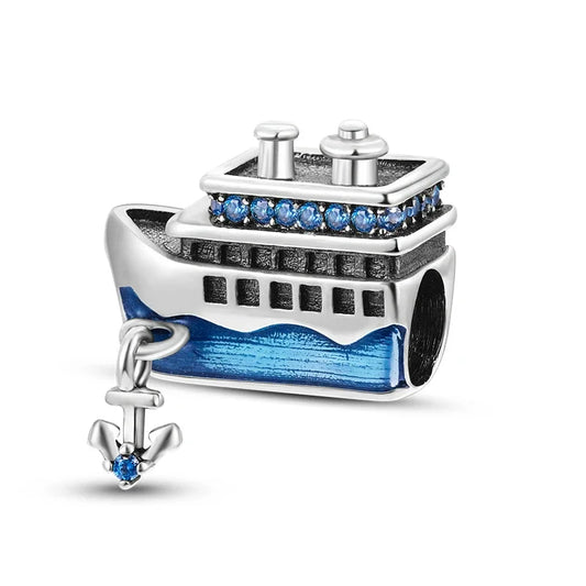 Sterling silver cruise ship charm with blue enamel details and a hanging anchor, symbolizing ocean travel and adventure.