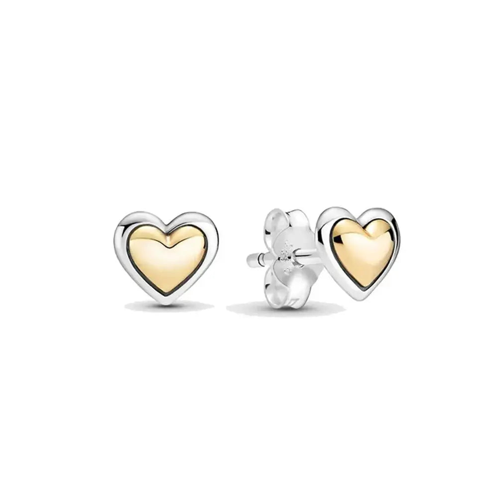 Heart-shaped stud earrings in sterling silver with a gold center, combining elegance and charm for daily wear.