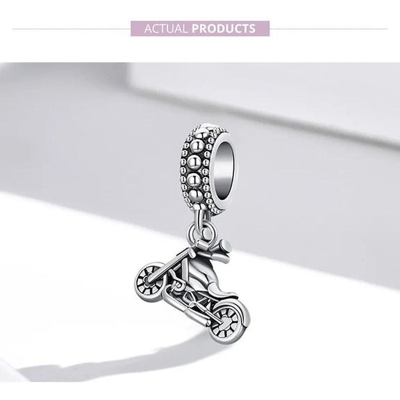 Exquisite Sterling Silver Harley-Davidson Motorcycle Charm for Enthusiasts - Close-up of a sterling silver Harley-Davidson motorcycle charm with detailed craftsmanship, attached to a beaded ring.