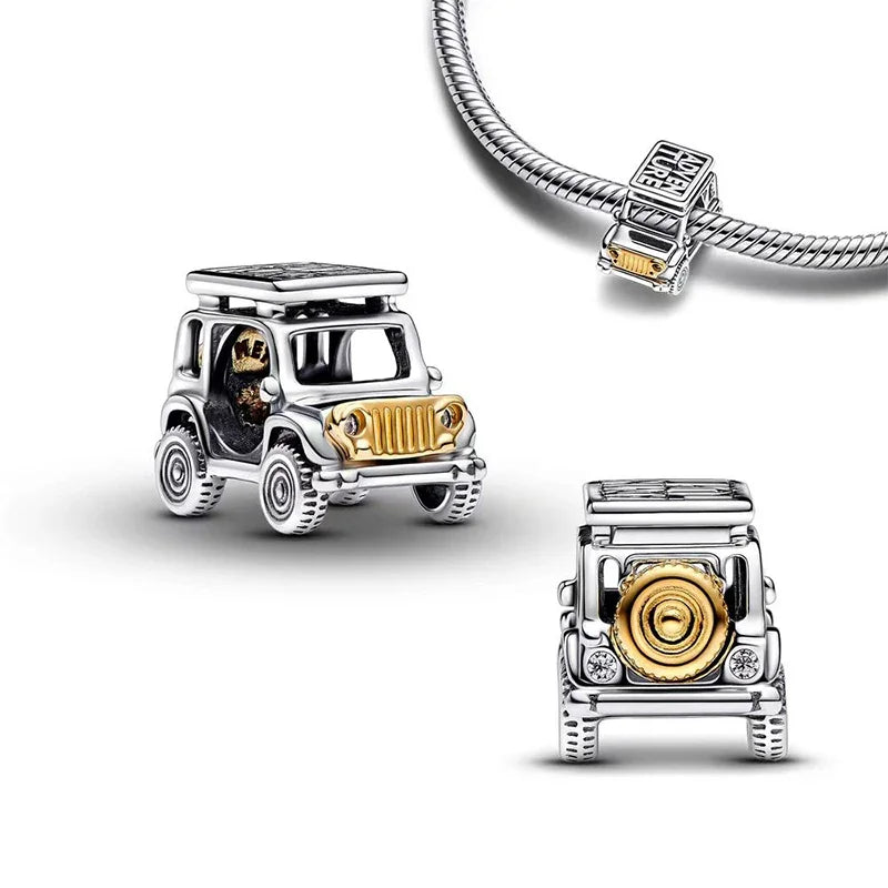 Sterling silver Jeep charm with gold accents, featuring detailed craftsmanship for adventure and travel lovers.