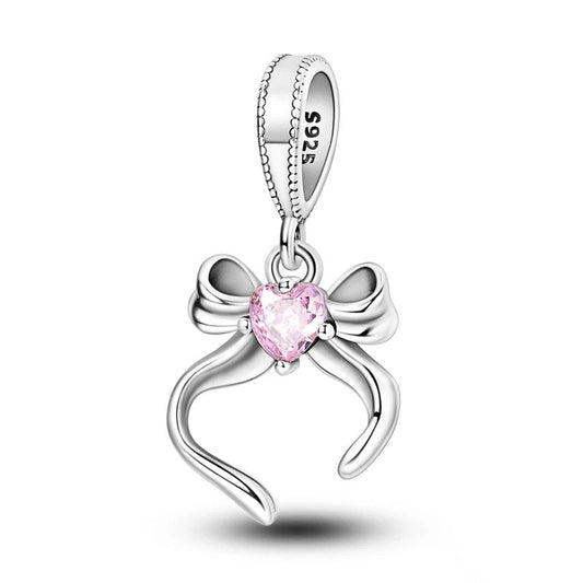 Sterling silver bow heart charm with pink crystal