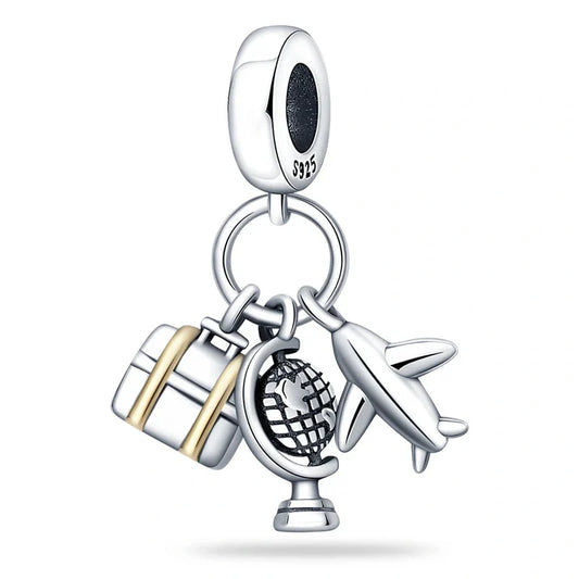 Sterling silver charm with a detailed globe, airplane, and luggage with gold-tone accents, perfect for travel lovers.