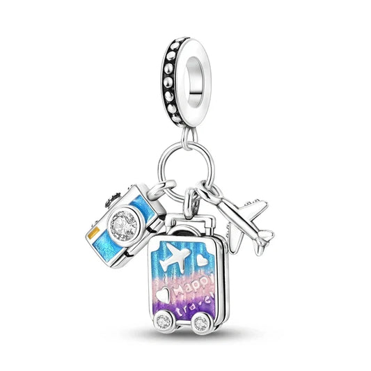 Sterling silver charm with a colorful luggage, airplane, and camera, ideal for travelers and adventure seekers.