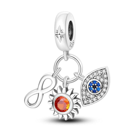 Charm trio featuring a sun, infinity symbol, and evil eye with colorful crystal accents for positive energy and style.