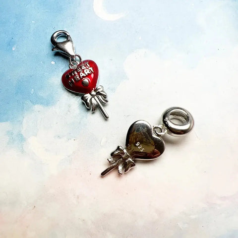 Two heart-shaped charms.