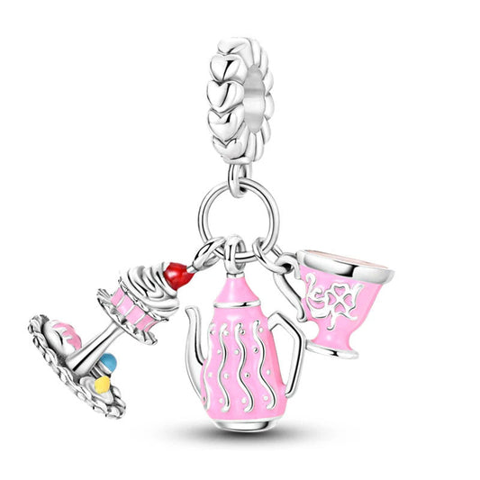 Silver tea party charm with pink enamel tea pot and cupcake.