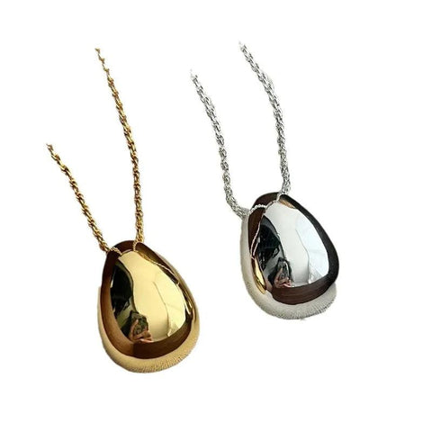 Chic Gold and Silver Teardrop Pendants for Every Occasion - Chic Gold and Silver Teardrop Pendants for Every Occasion - two gold and silver pendants with a black and white photo