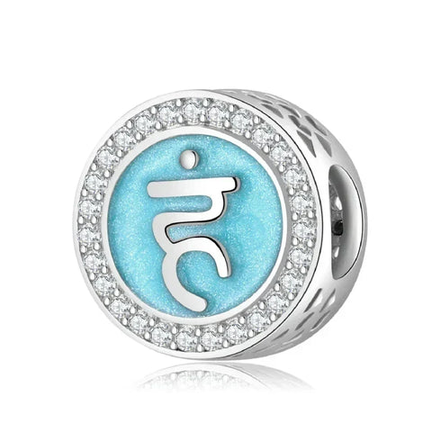 Silver charm with blue symbol and crystal accents.