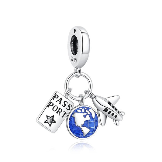 Sterling silver charm featuring three pendants on a connector ring: an engraved passport booklet with a star crystal, a blue enamel world globe, and a silver airplane, attached to a S925 clip bead