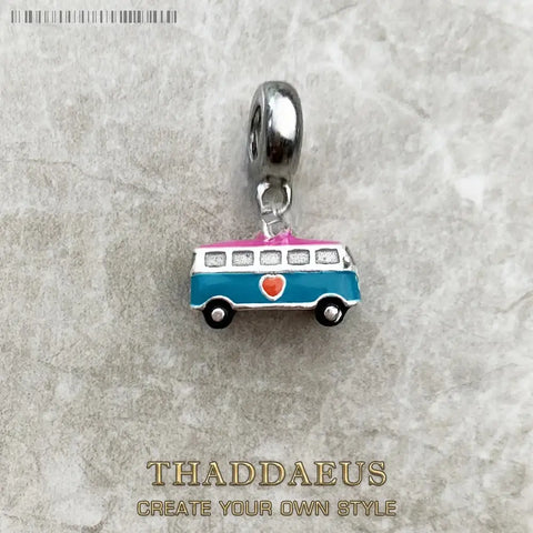 Charm of a blue and pink van.