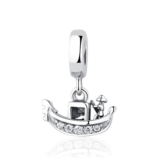 Silver-tone gondola boat dangle charm with a gondolier figure and clear crystal stones along the hull, attached to a polished bail ring