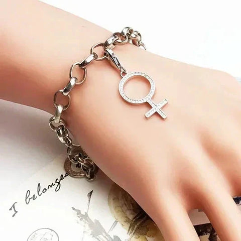 Silver chain bracelet with female symbol charm.